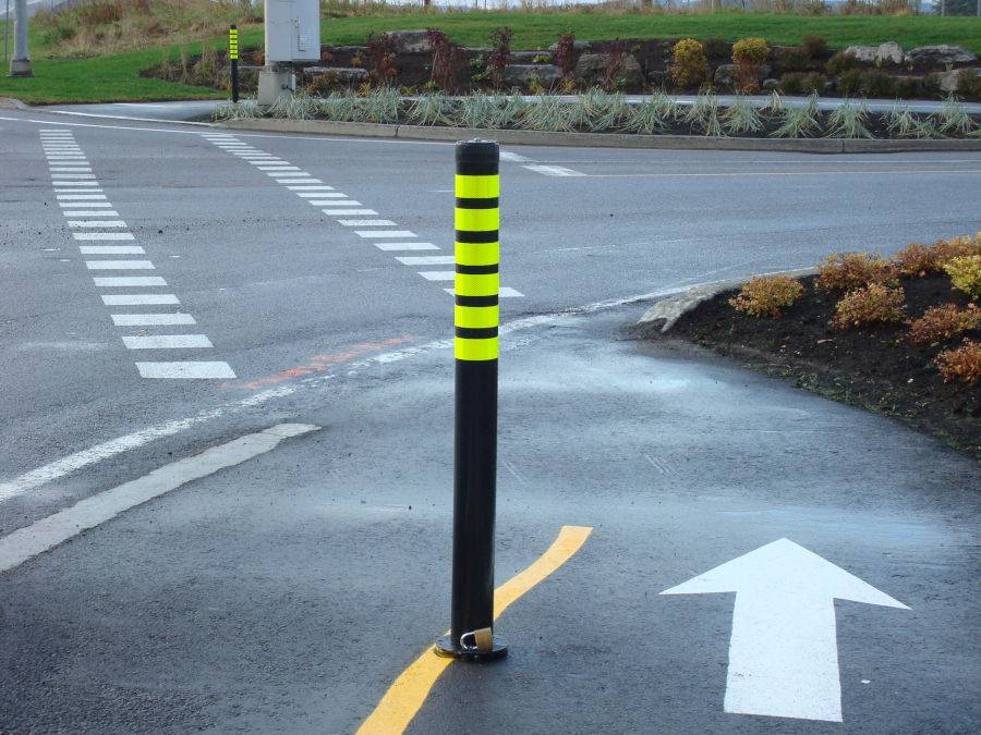 A bollard on a pedestrian crossing